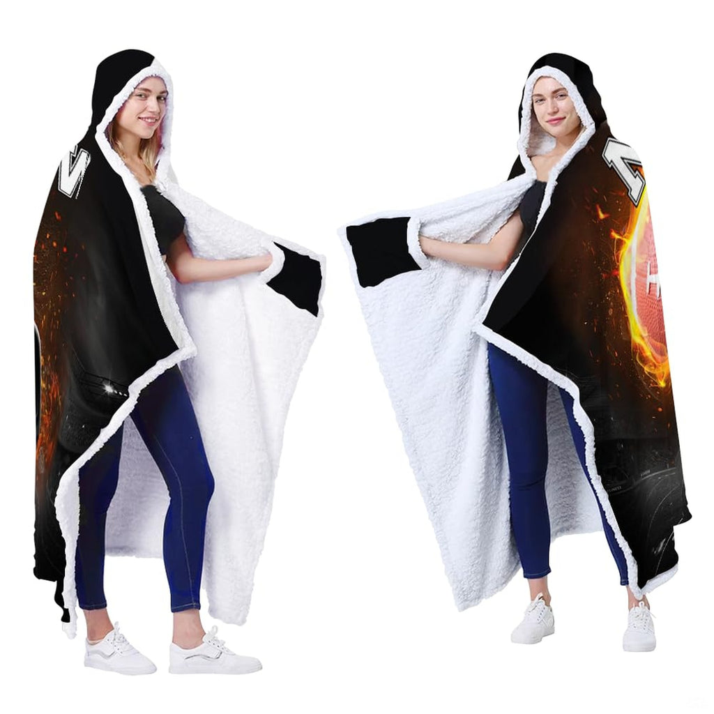 Flaming football helmet stadium throw blanket styled across contemporary living room couch
