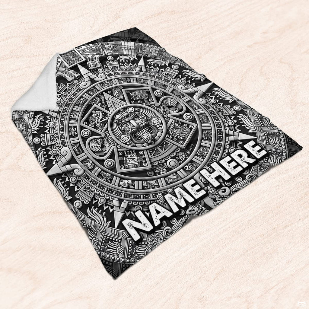 Detailed view of carved calendar markings and radiating sun ray artwork in silver-gray tones.