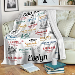 Close-up of the uplifting Scripture typography, Bible chapter citations, and Christian cross icons on a throw blanket