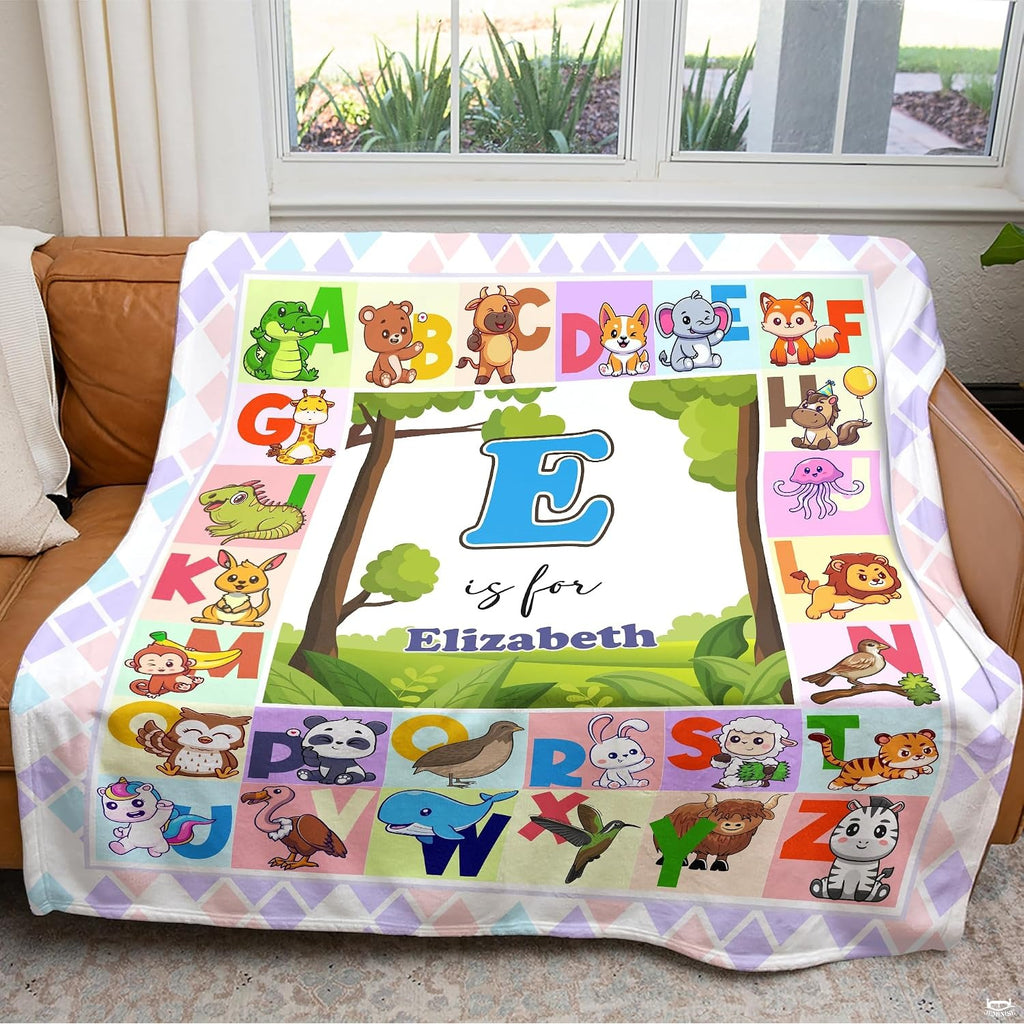 Illustrated A to Z cute animal alphabet chart surrounding central woodland meadow landscape, view 4.