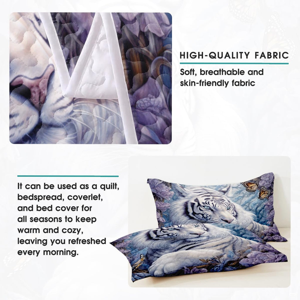 Folded bedding arrangement displaying floral white tiger art and muted icy-blue tones.