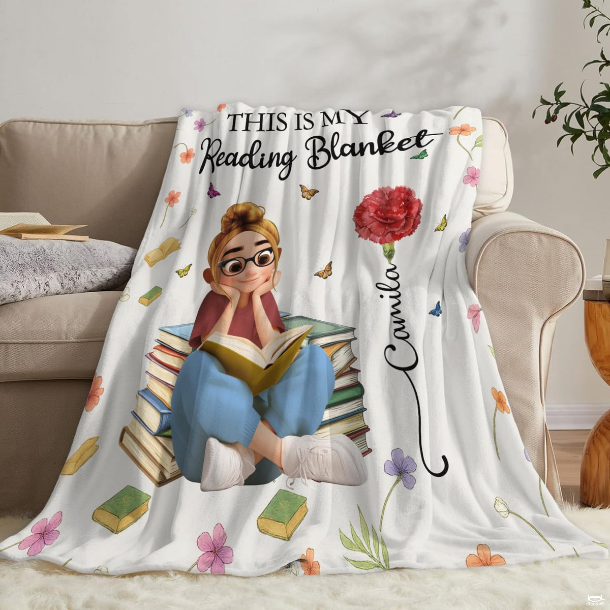 Neatly folded carnation reader girl throw blanket highlighting precise edge hem stitching and vibrant art print.
