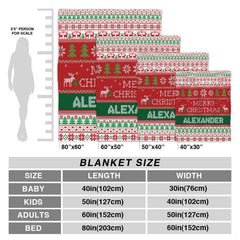 Folded holiday blanket highlighting green pine trees and red reindeer