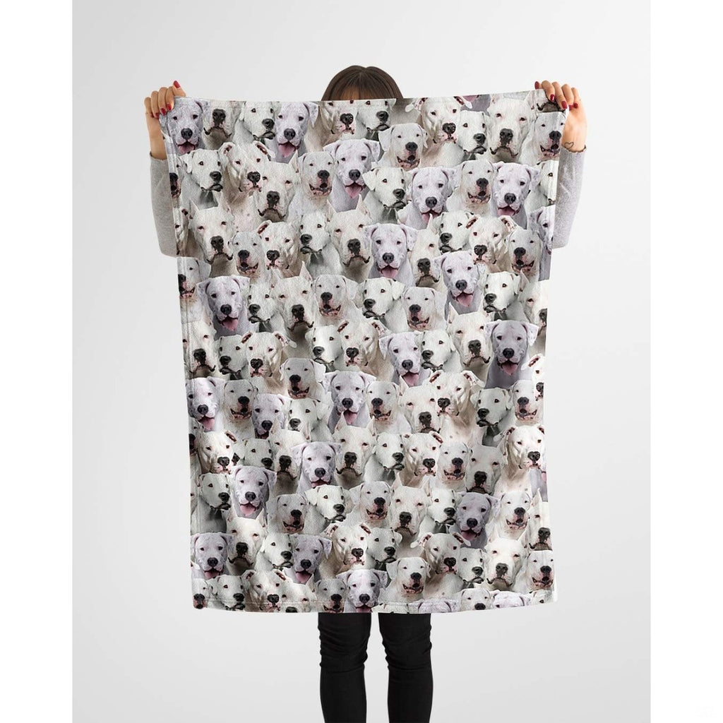 Dogo Argentino dog lover throw blanket styled across a couch in a living room.
