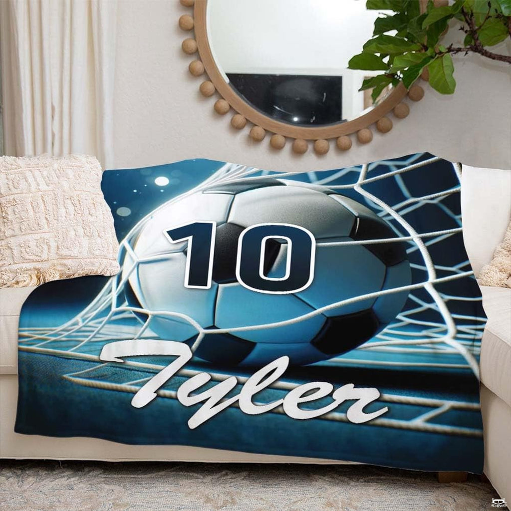 Coordinated sports bedroom styling featuring night game stadium artwork with bold cyan and deep navy contrast.