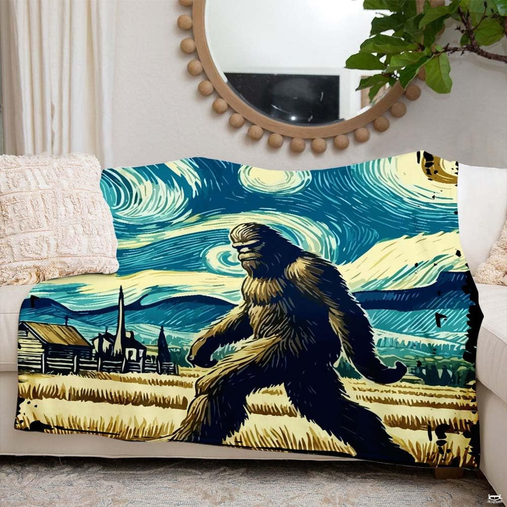 Artistic Bigfoot throw blanket arranged on a cream couch beside round mirror