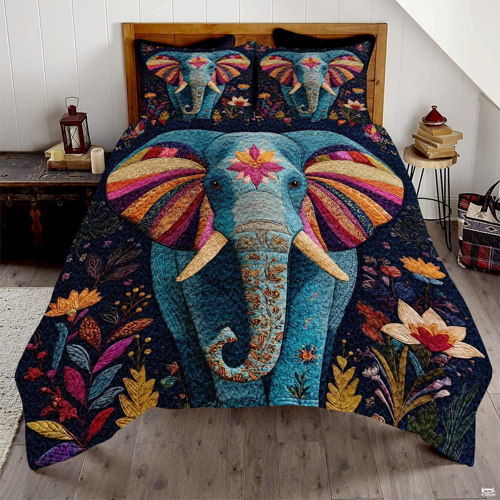 Burgundy and slate blue elephant bedding set showing an ornate mandala elephant silhouette among colorful patchwork tiles.