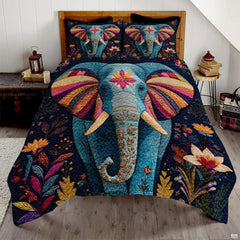Burgundy and slate blue elephant bedding set showing an ornate mandala elephant silhouette among colorful patchwork tiles.