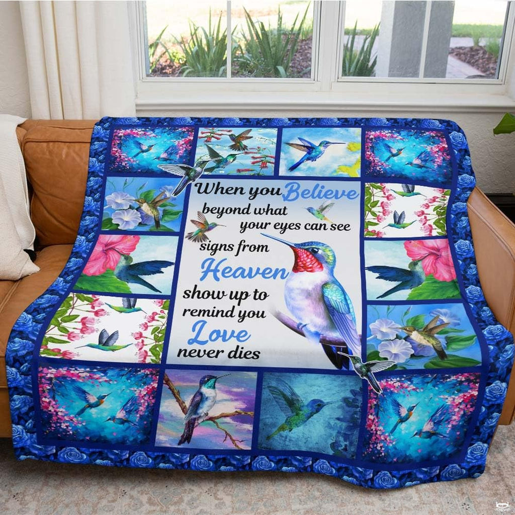 Hummingbird floral collage throw blanket view 5 highlighting iridescent bird artwork and garden room styling