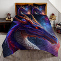 Indigo dragon with copper horns and glowing orange eye displayed on a bed