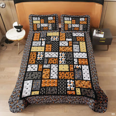Coordinated bedroom arrangement featuring Halloween mosaic bedding and matching pillowcases