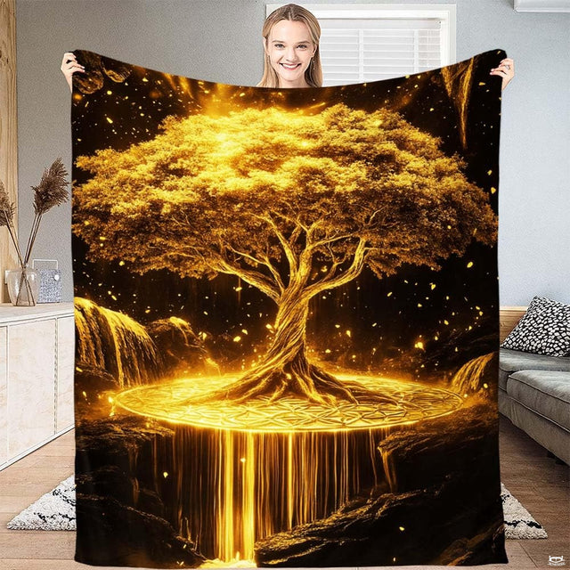 Glowing golden Tree of Life waterfall throw blanket held open by woman