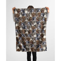 Person holding up a repeating Spanish curly retriever blanket against a plain background.