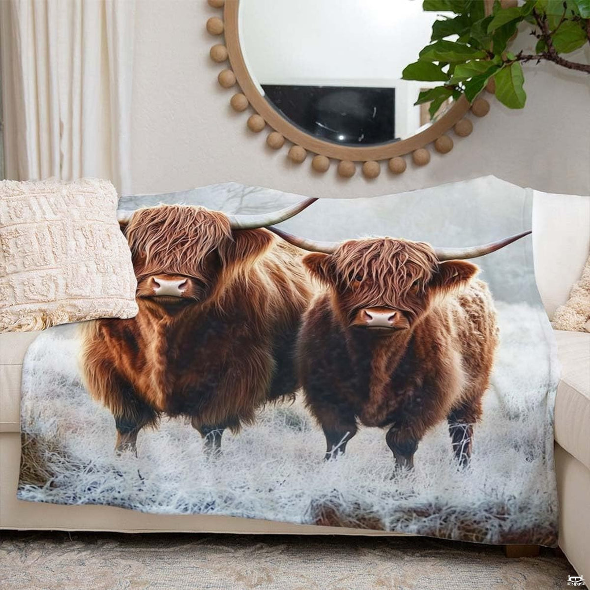 Close-up visual detail of horned cattle illustration on scenic scottish highland bedding.