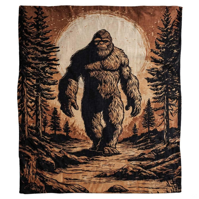 Vintage Bigfoot throw blanket view 2 highlighting Sasquatch silhouette, woodcut pine trees, and sepia moon