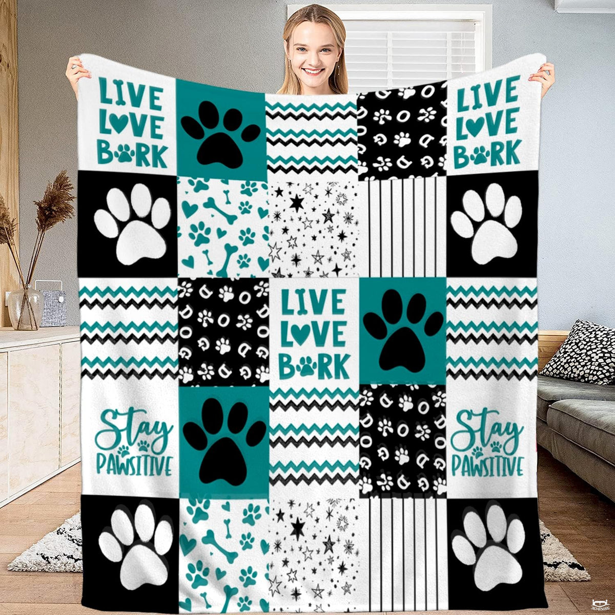 Teal dog paw print patchwork throw blanket with bold puppy paws and chevron zigzag blocks