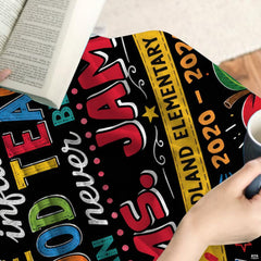 Close visual details of chalkboard lettering style and playful scholastic drawings across bedding.