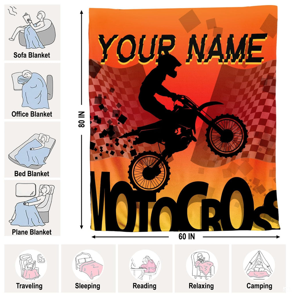 Orange motocross racing throw blanket folded neatly on bedroom chair