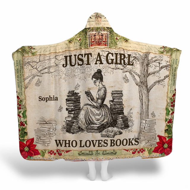 Hooded throw blanket displaying vintage reader girl, book stacks, tree, and poinsettia borders.