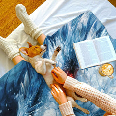 Overhead lifestyle scene showing the ice dragon art throw blanket spread out.
