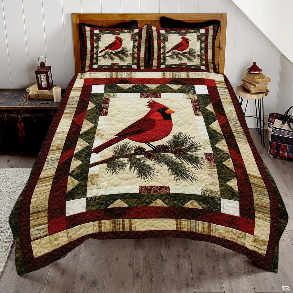 Vintage winter cardinal red bird patchwork bedding set displayed neatly on a bed in a rustic bedroom