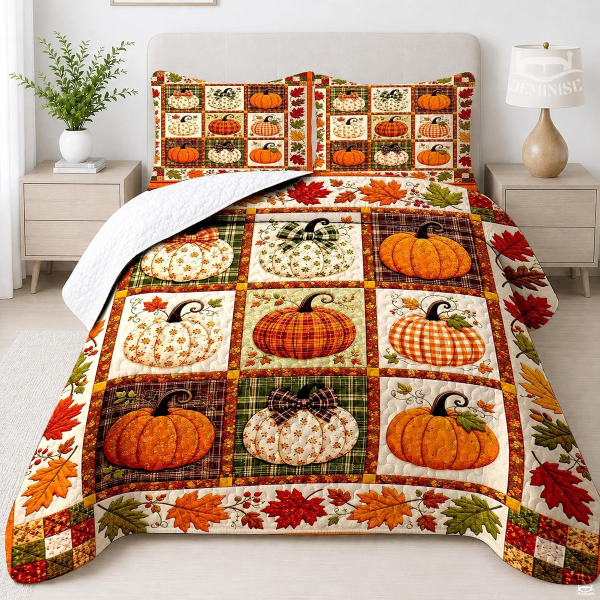 Autumn bedding set featuring a nine-block grid of patterned pumpkins and fall leaf borders
