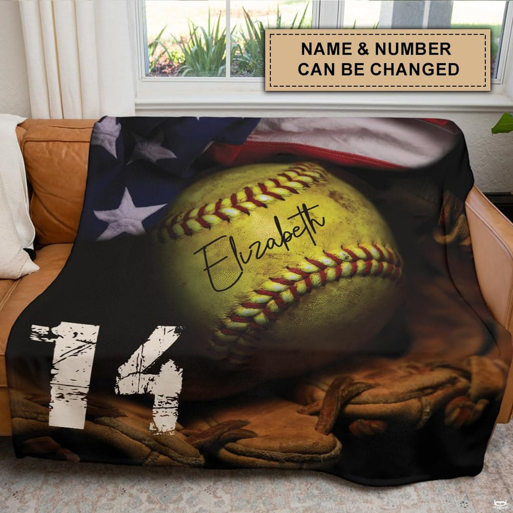 Softball blanket styled over brown leather couch in sports themed living room