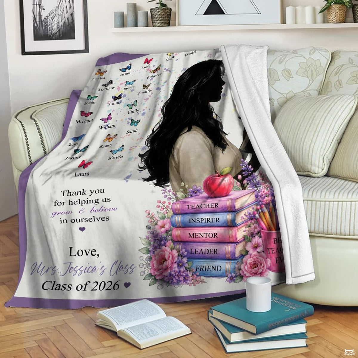 Close-up of pastel book stack, colored pencils, and shiny red apple on decorative bedding.