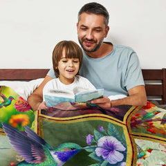 Detailed botanical vignettes with orange hibiscus and perched hummingbirds across colorful decorative panels.