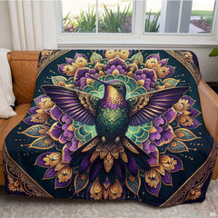 Lifestyle display of a person resting with the purple hummingbird mandala throw blanket.