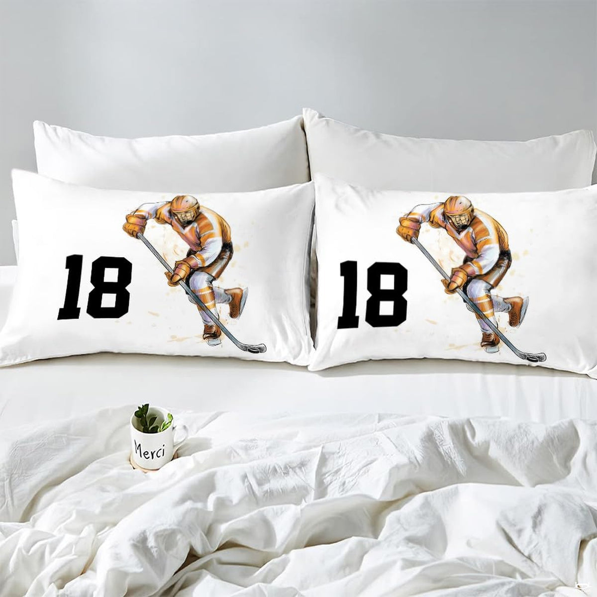Side angle view of athletic winter sports bedding showing bronze amber and charcoal tones on mattress