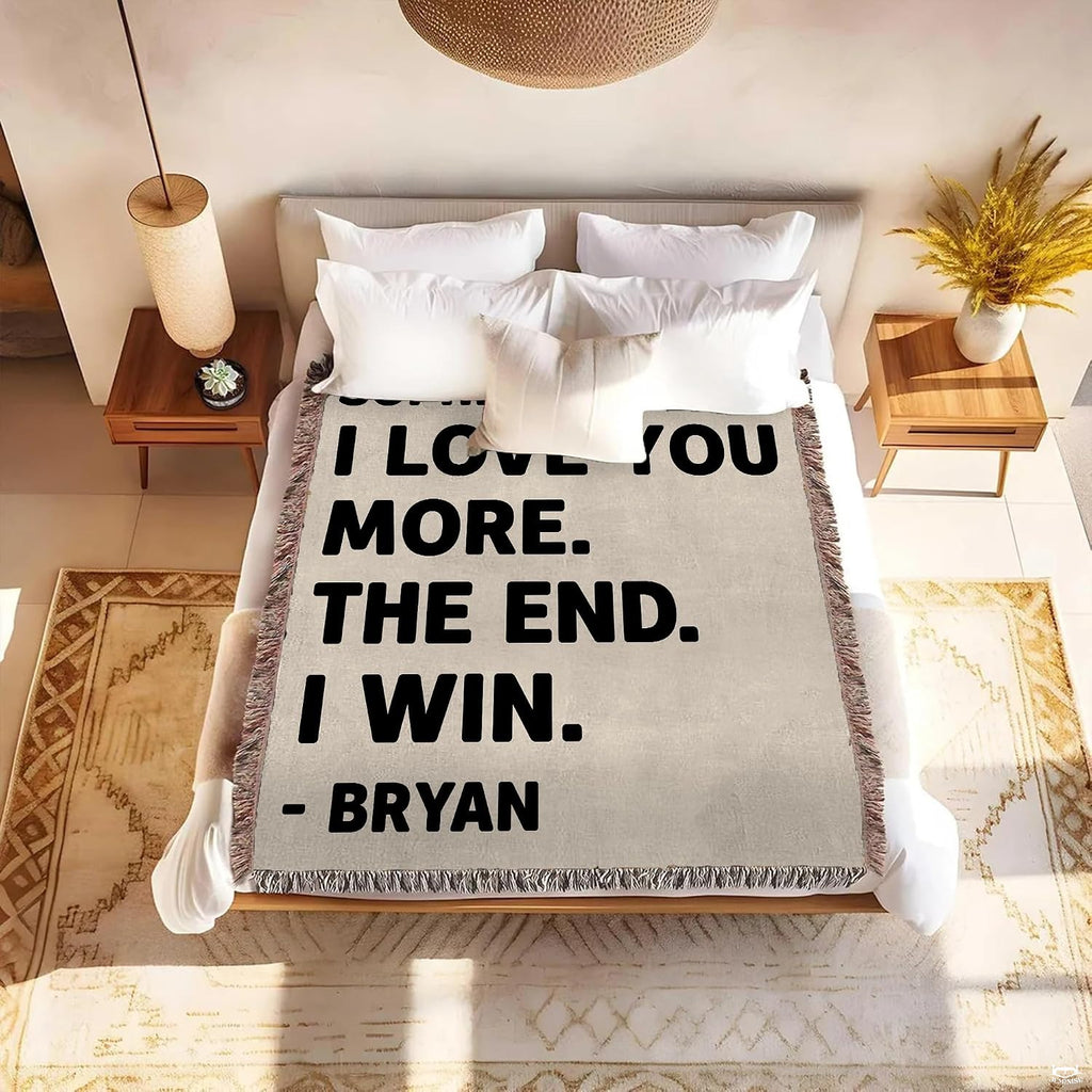Detail of textured oatmeal background and bold romantic typography on a blanket