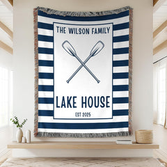 Cabin bedding sets featuring crossed canoe paddles and bold navy stripes.