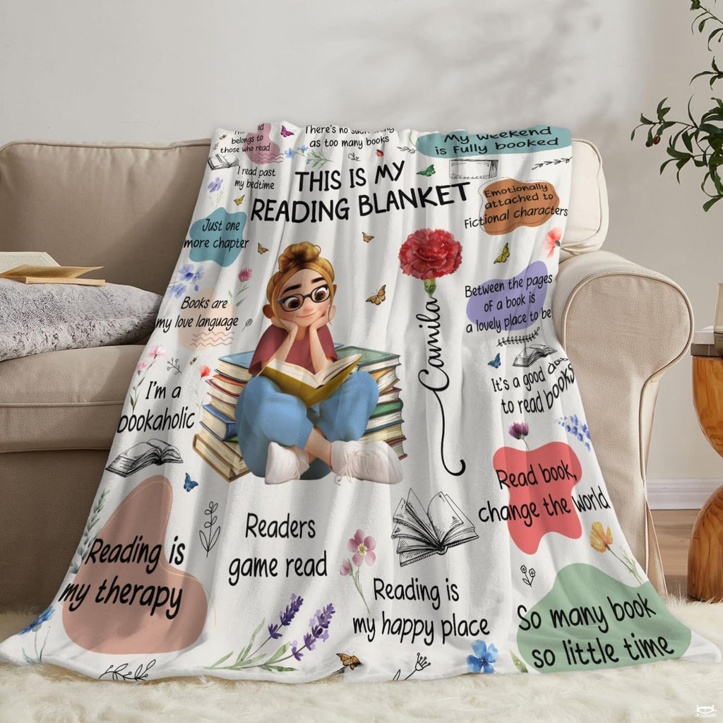 Neatly folded bookish sayings throw blanket highlighting precise edge hem stitching and vibrant art print.