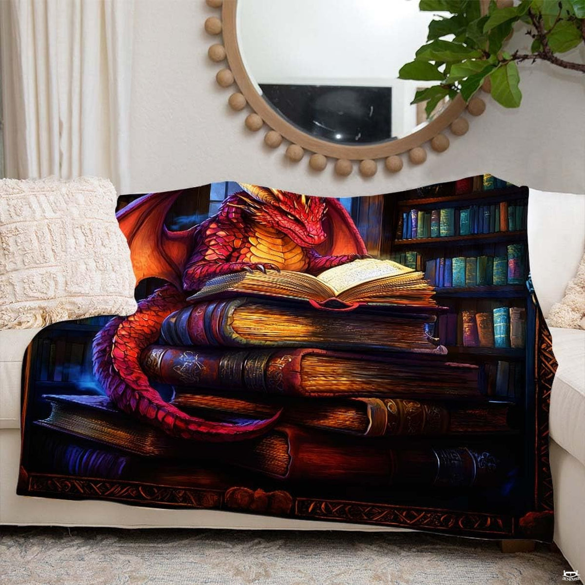 Lifestyle setting displaying the dragon reading throw blanket neatly folded on an armchair.