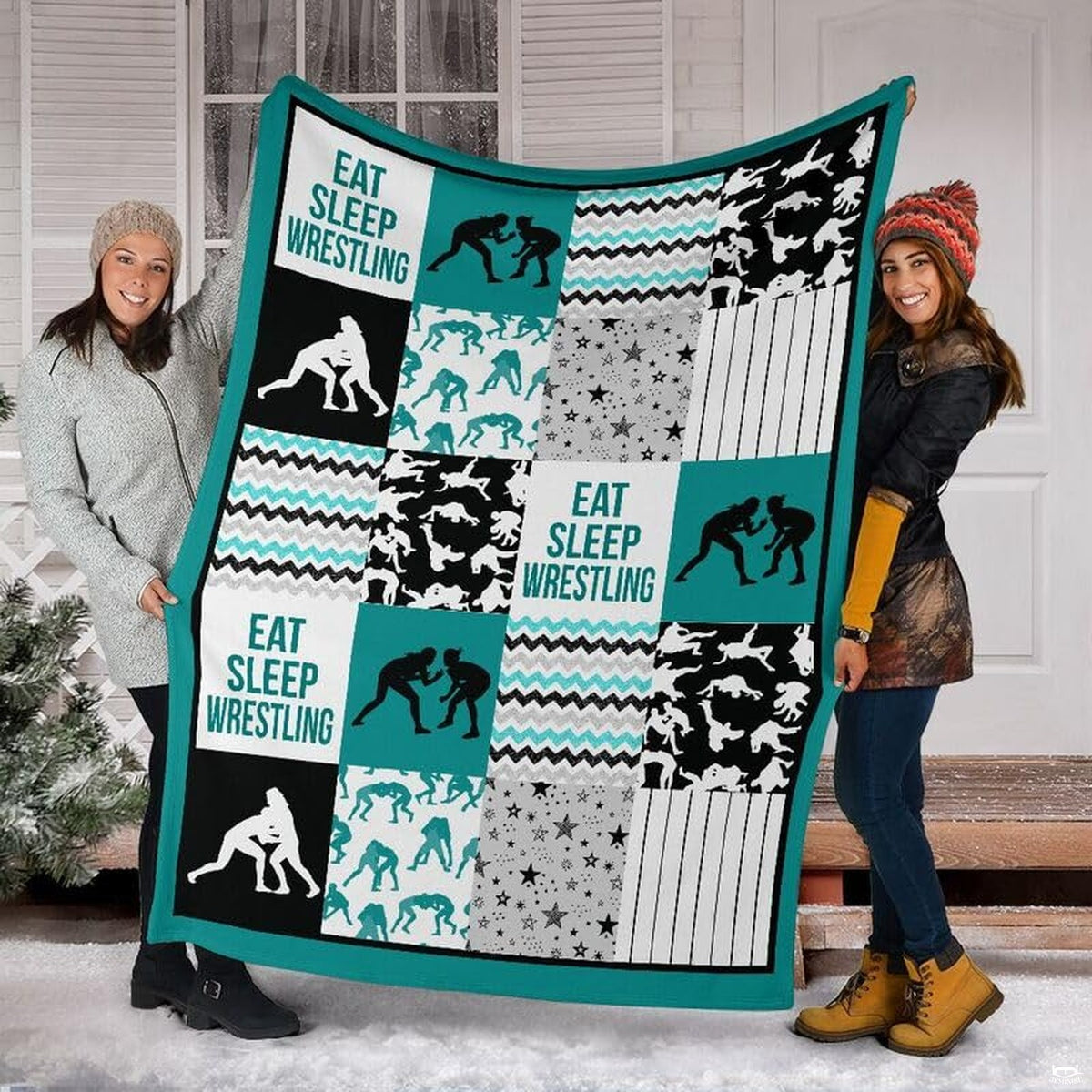 Detail view of neat hemmed edge and high-contrast printing on teal wrestling blanket.