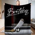 Ice hockey stick blade and puck goal crease blanket held upright