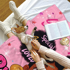 Bedroom lifestyle setting showing the cheerful pink girl blanket styled across a bed.