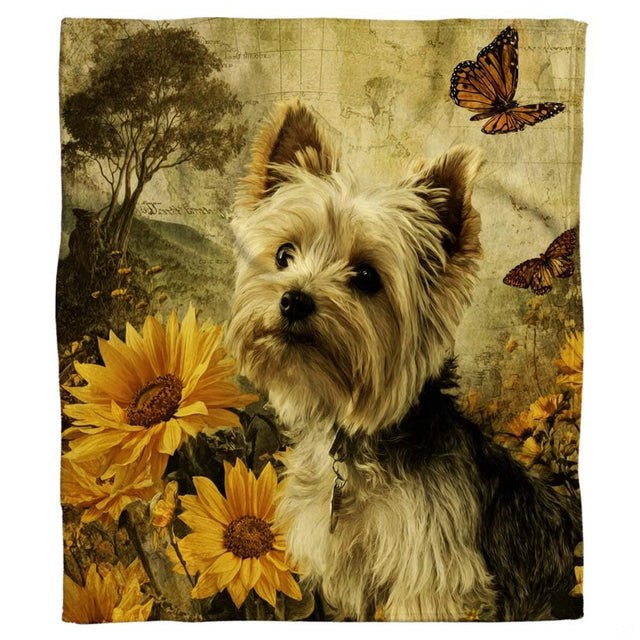 Close-up of the painted Yorkshire Terrier face displaying alert pointed ears and golden fur alongside sunflowers