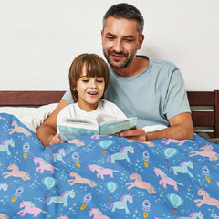 thematic accent perspective of bedroom featuring vibrant royal blue bedding set with magical pastel unicorn pattern.