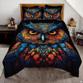 Starry twilight blue and amber owl wildlife bedding set displayed neatly on a bed in a rustic bedroom
