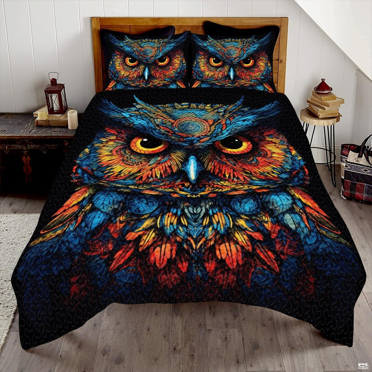 Starry twilight blue and amber owl wildlife bedding set displayed neatly on a bed in a rustic bedroom
