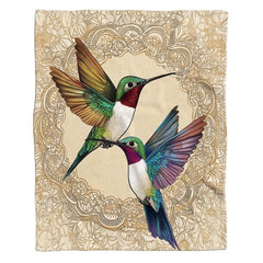 Close-up of colorful hummingbird plumage and delicate lace mandala pattern.