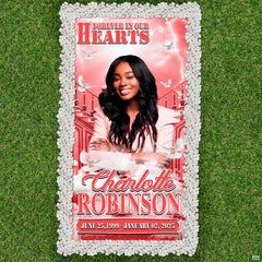 Aerial view of pink celestial dove memorial blanket centered on green lawn framed by stones