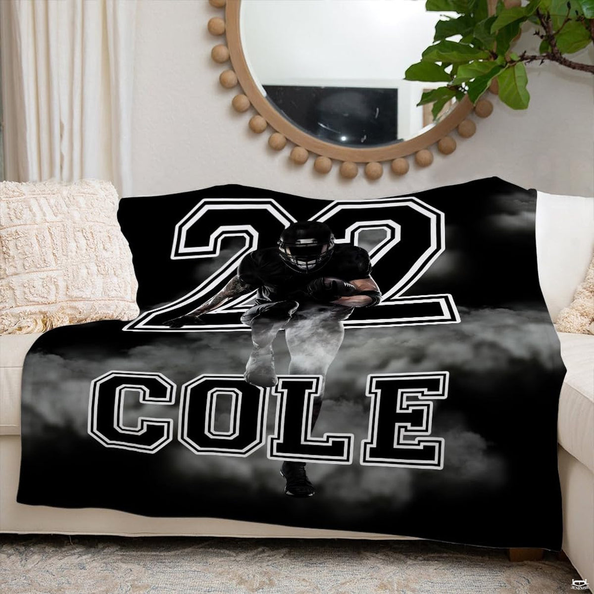 Detailed view of oversized varsity jersey numbers and billowing white smoke on football throw blanket