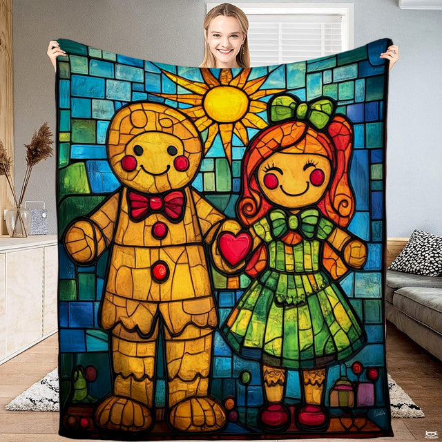 Stained glass gingerbread couple throw blanket featuring gingerbread boy and girl with red heart under sun