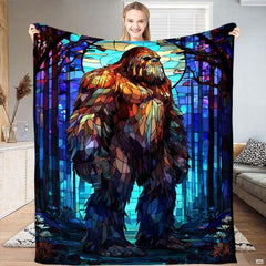 Stained glass Bigfoot mosaic art blanket featuring colorful Sasquatch in moonlit forest.