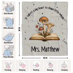 Overhead look at storybook illustration bedding artwork surrounded by rustic bedroom accessories.
