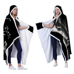 Football player monochrome throw blanket styled across contemporary gray sofa in modern sports den