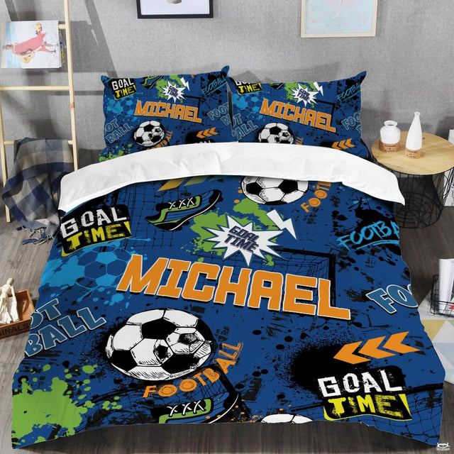Close-up perspective of soccer bedding detailing sapphire blue field lines, white accents, and bold typography